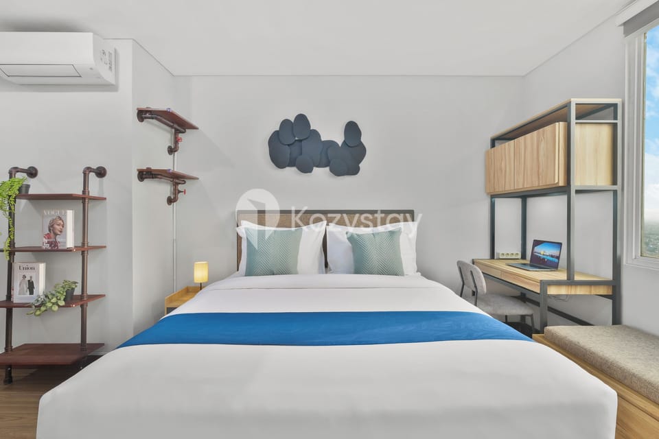 Apartment, 1 Bedroom, City View | Desk, laptop workspace, iron/ironing board, free WiFi
