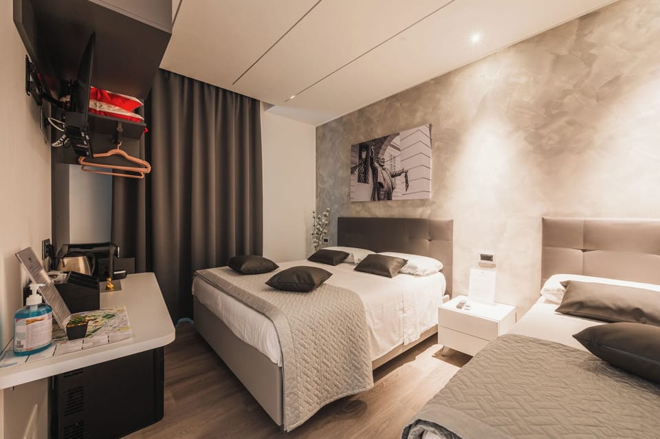 Comfort Triple Room, City View | Free minibar, in-room safe, desk, laptop workspace