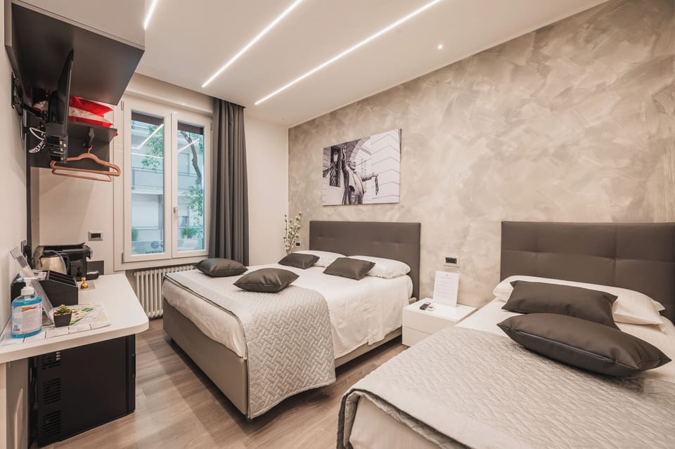 Comfort Triple Room, City View | Free minibar, in-room safe, desk, laptop workspace