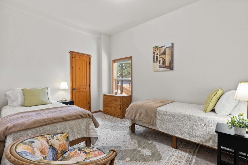 The final bedroom retreat offers a pair of twin-sized beds​