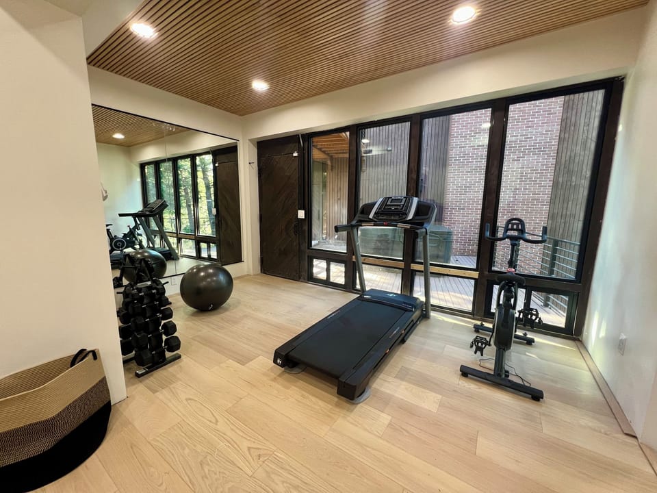 Private fitness center - gym with bathrooms, shower, sauna, hot tub. 