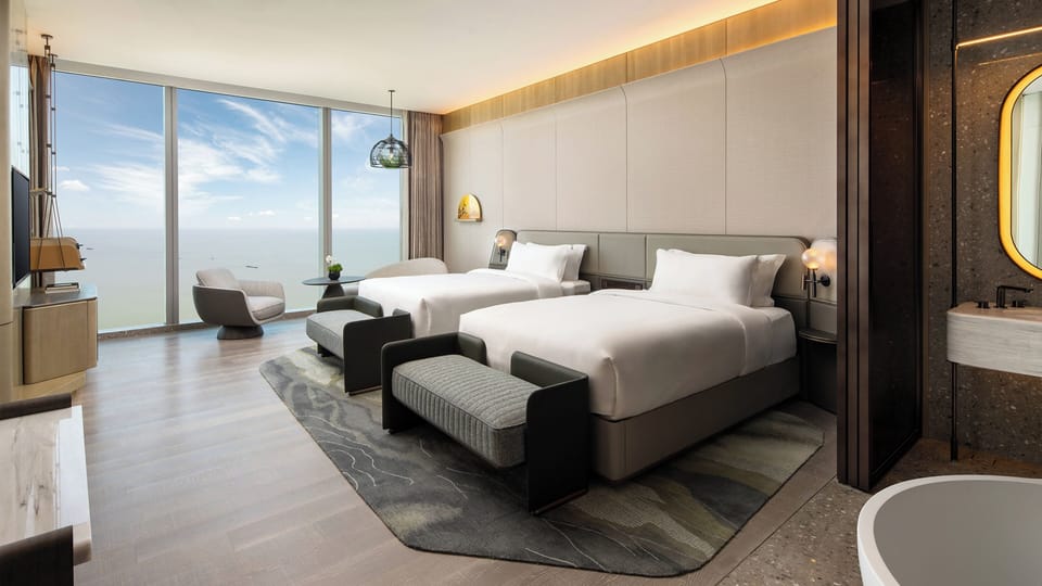Premium bedding, down comforters, pillowtop beds, free minibar