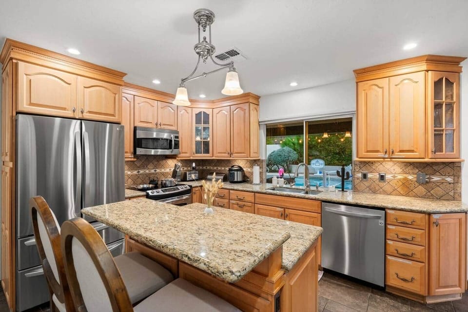 Fully stocked kitchen with labeled drawers for easy access. Abundant dishes, Instant Pot, juicer, toaster, and all essentials. Glassware, plasticware, dish soap, dishwasher pods, and paper towels provided.