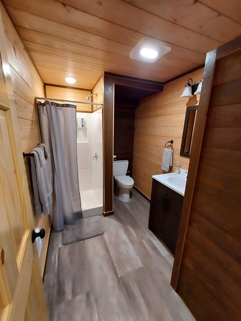 Refresh with a hot shower in a clean, modern bath.