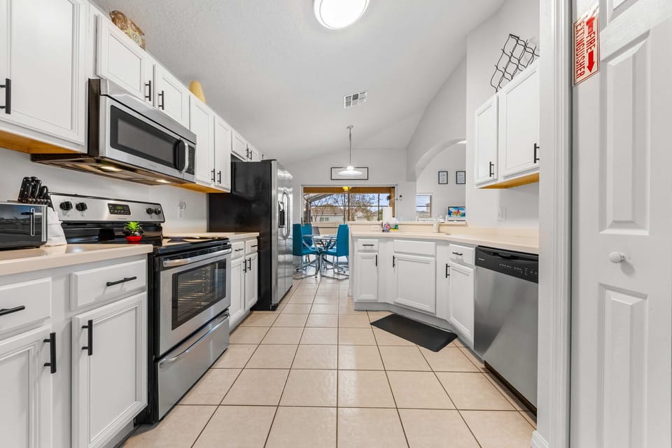 Large family kitchen with stainless steel appliances. 