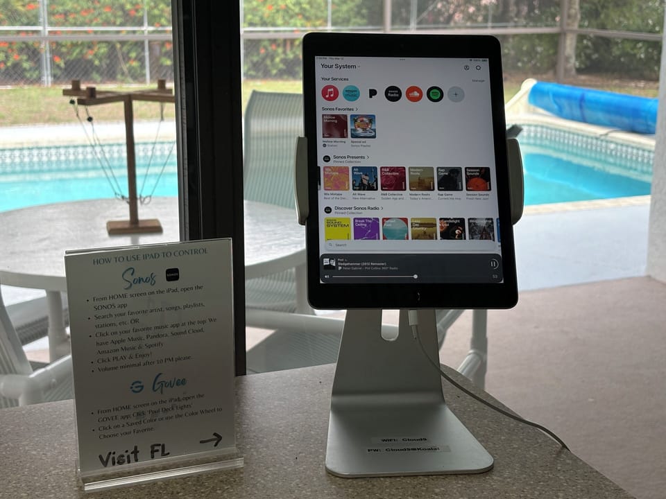 iPad lets you control the poolside Sonos speaker system & outdoor lighting.