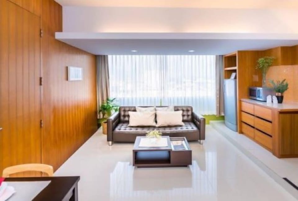 One-Bedroom Corner Suite | Living area | LED TV
