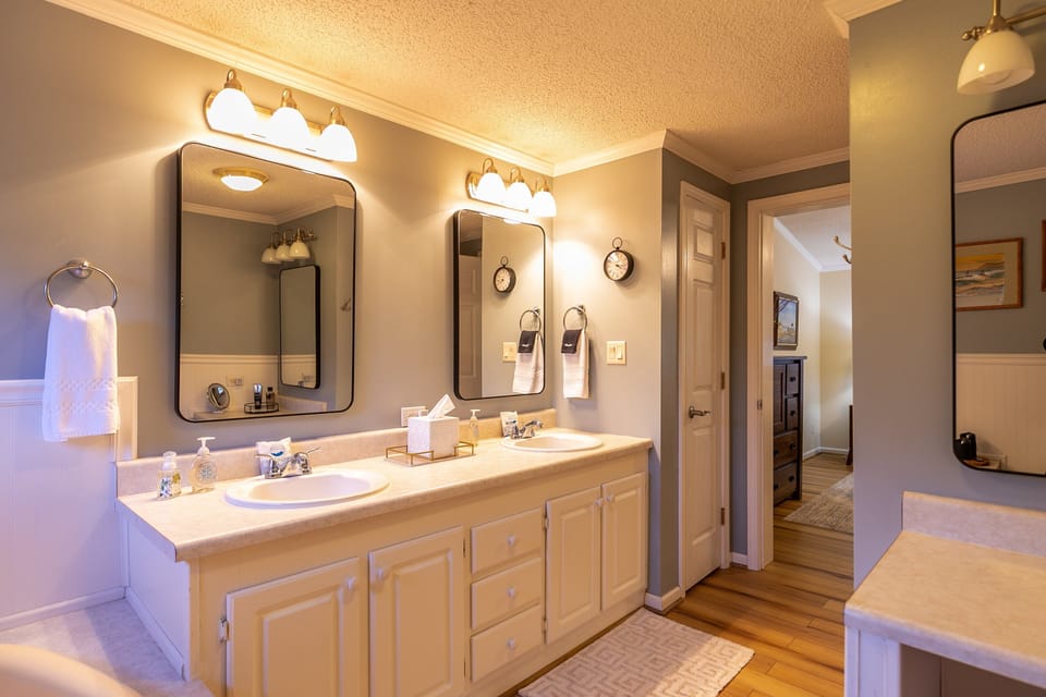 Two sinks, two mirrors, plenty of room to get ready. The master bath at Our Happy Nest keeps things easy for the whole crew.