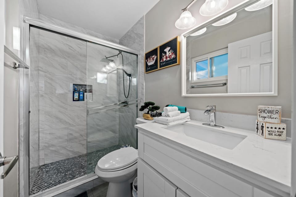 Bright, clean bathroom with a convenient walk-in shower.