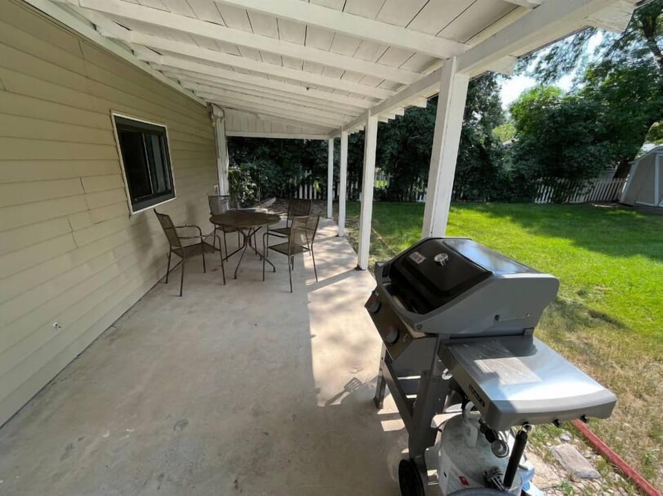 Take your meals outside on the covered patio with gas grill, outdoor dining space and a wood burning firepit.