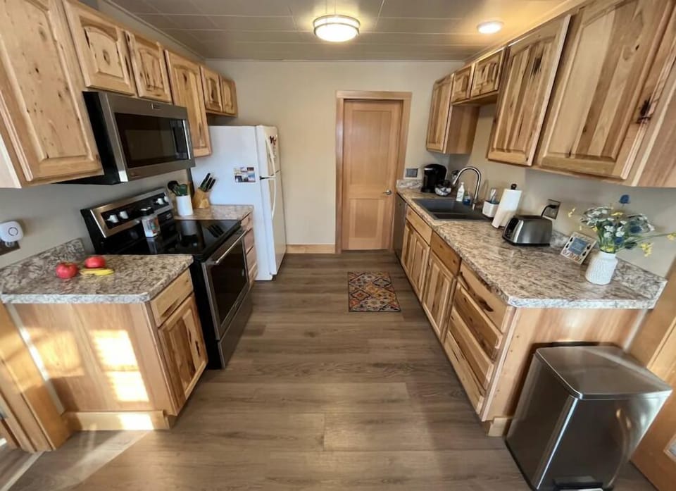 The welcoming kitchen is well-appointed and features modern appliances for easy meal preperation