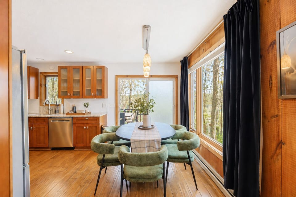 Eat in kitchen • Wooded views • Extra seating available