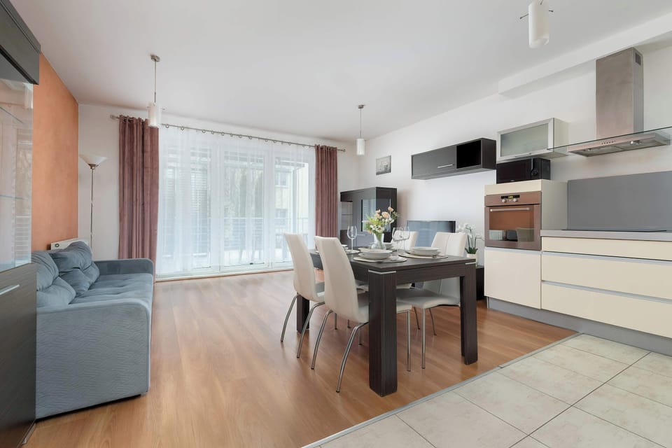 Elegant kitchenette with a modern dining table and tasteful lighting.