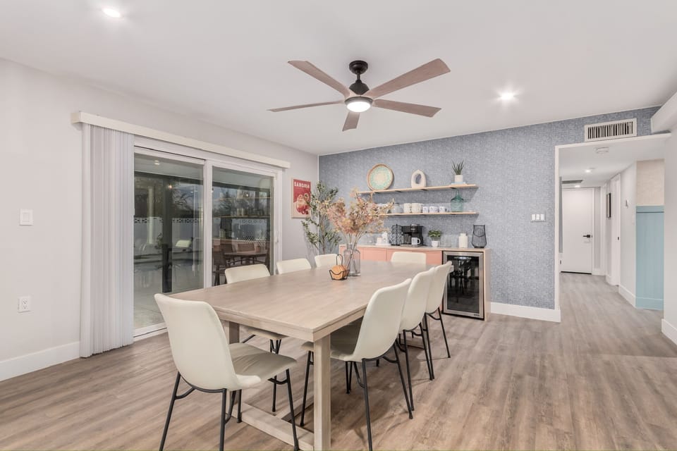 Dining for 8, direct pool and patio views with a built-in coffee/wine bar.