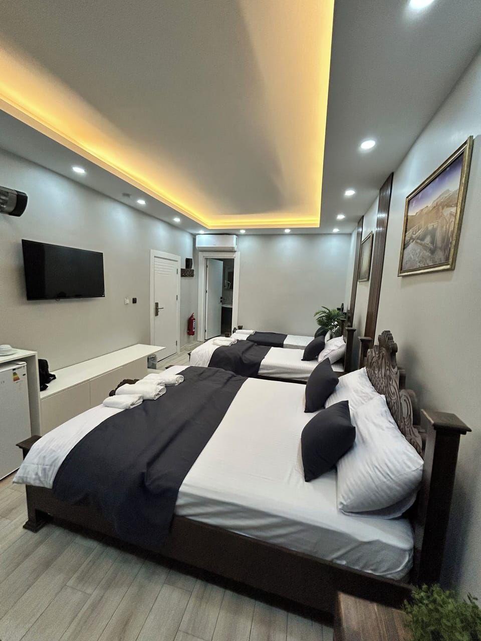 Deluxe Quadruple Room, Patio, City View | Desk, laptop workspace, free WiFi