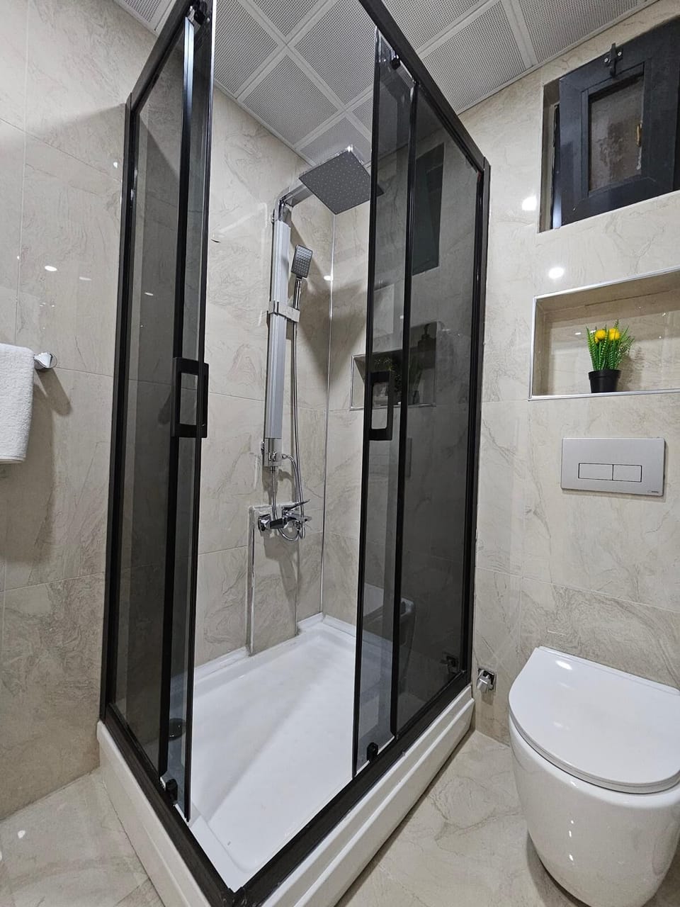 Deluxe Triple Room, Patio | Bathroom | Shower, hair dryer, towels, soap