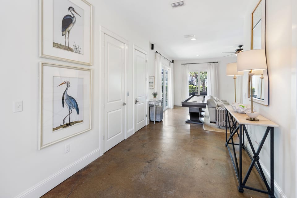 Step into your bright, airy space where coastal art and elegant furnishings create a welcoming atmosphere for your perfect getaway.