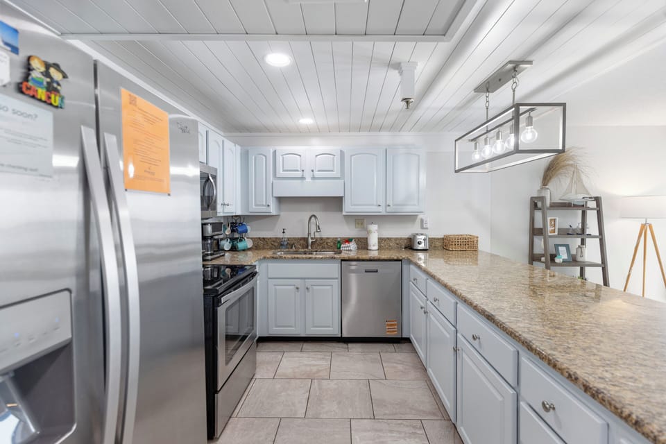 Your fully equipped kitchen features granite countertops, stainless steel appliances, and everything you need to create memorable meals during your stay.