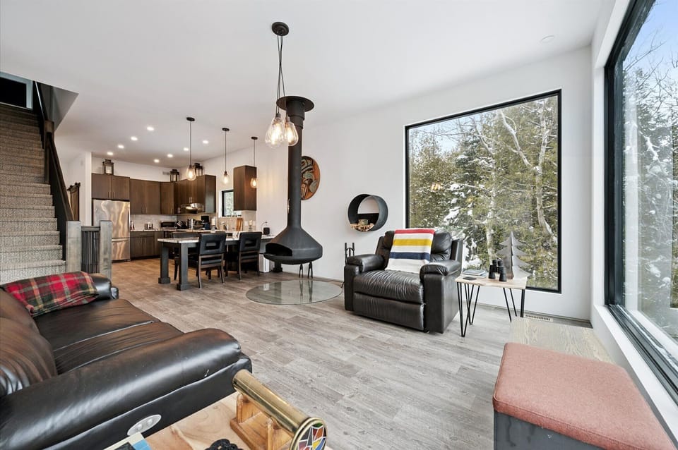 The heart of the home flows effortlessly between kitchen, dining, and living areas, making it easy to cook, snack, and spend time together.