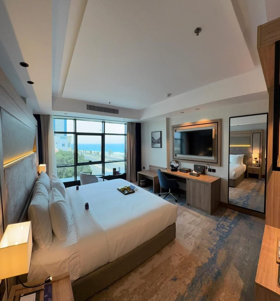 Deluxe Suite, Partial Sea View | In-room safe, laptop workspace, iron/ironing board, WiFi (free)