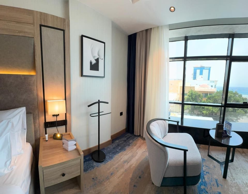 Deluxe Suite, City View | In-room safe, laptop workspace, iron/ironing board, WiFi (free)