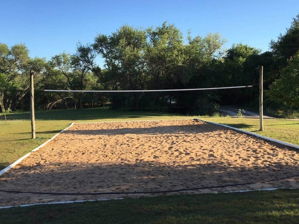 Sand volleyball court on the property.