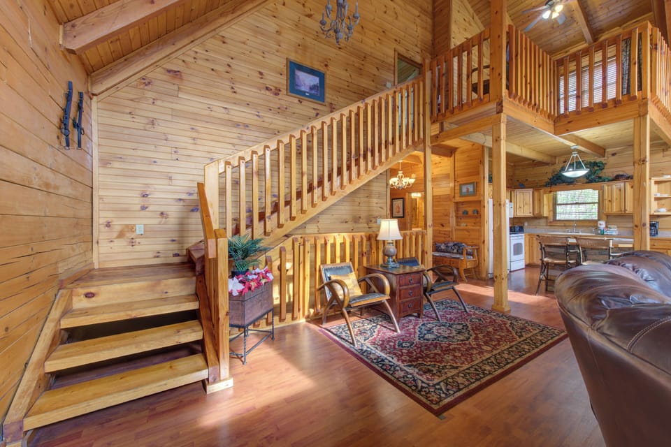Step into this stunning log cabin where rustic charm meets modern comfort, featuring soaring ceilings and warm wood throughout.
