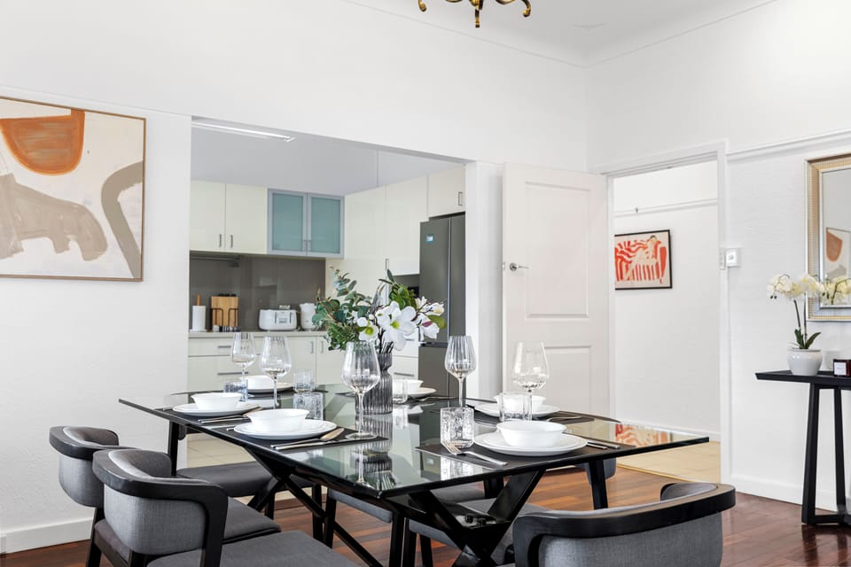 Enjoy intimate dinners at this chic table right off the modern kitchen.