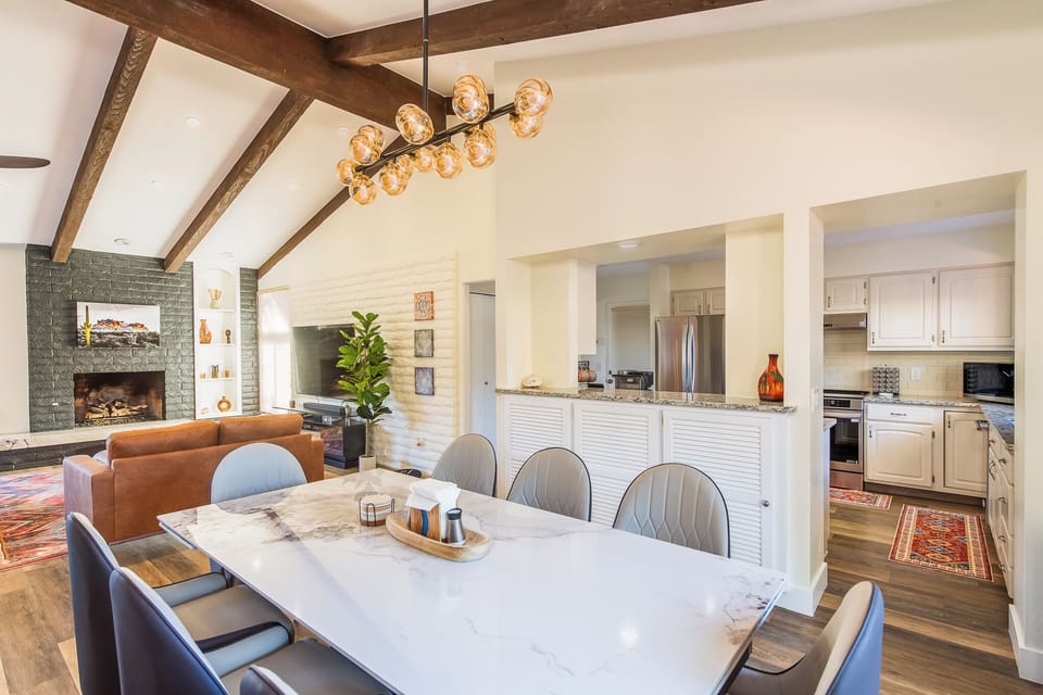 Central dining with marble table—perfect for family meals and entertaining.