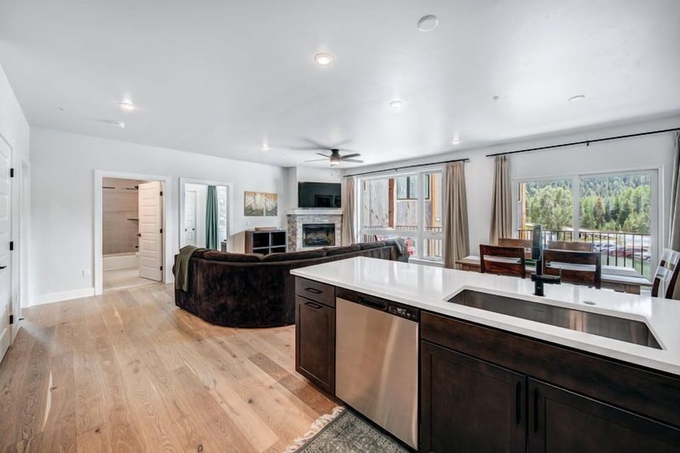 Enjoy effortless meal preparation in the sleek kitchen that overlooks the cozy living space, combining convenience with style.