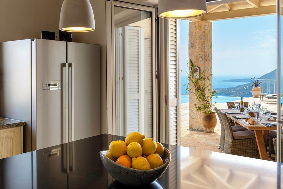 The outdoor dining area is seamlessly served by the kitchen.