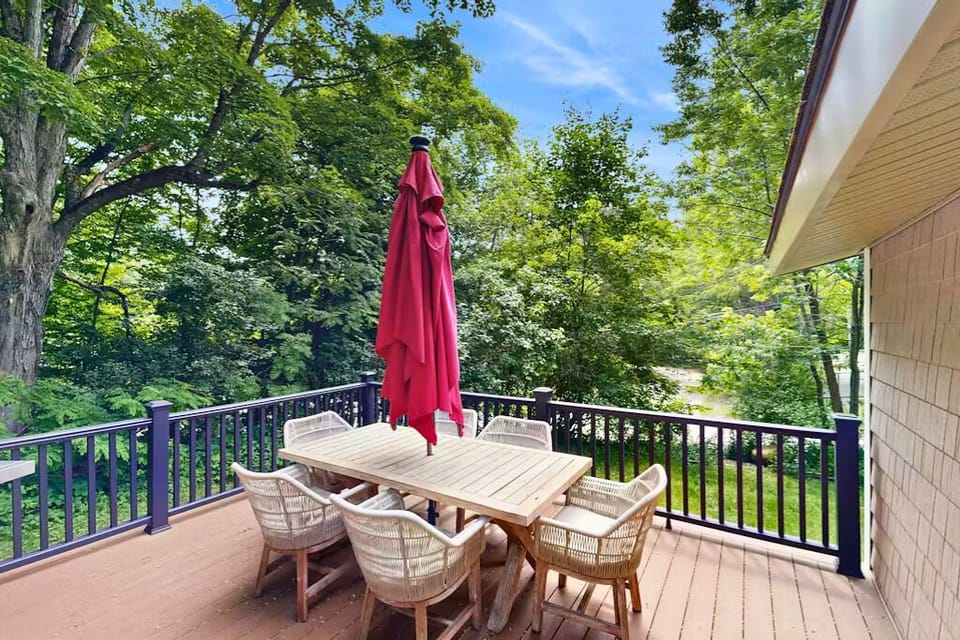 Peaceful deck with dining space and forest views—perfect for relaxing