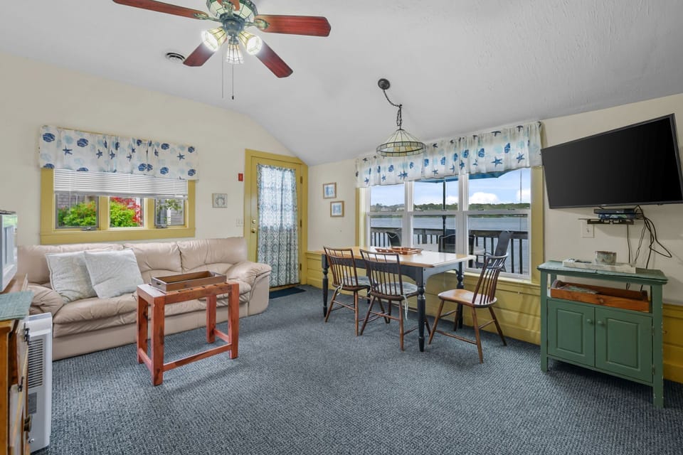 Living and dining area with beautiful views of the water