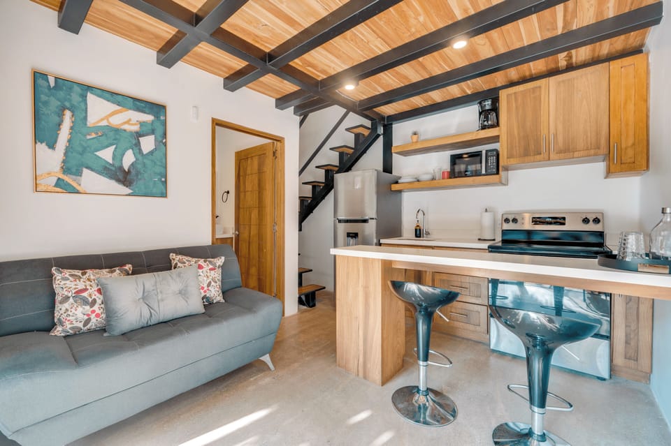 Full Kitchen with a stainless steel stove, fridge, and microwave