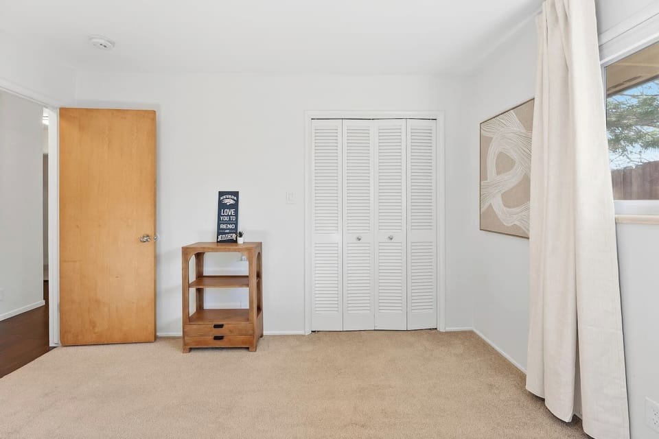 Comfortable bunkbed setup in a large room with storage space!