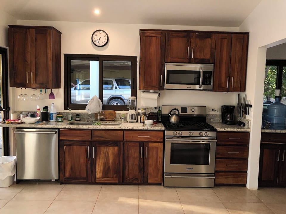 full kitchen with dishwasher, 2 fridges, propane range, microwave. 