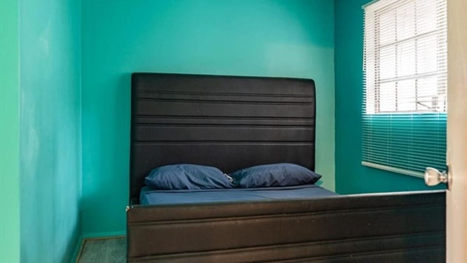 Bedroom with large bed and natural light