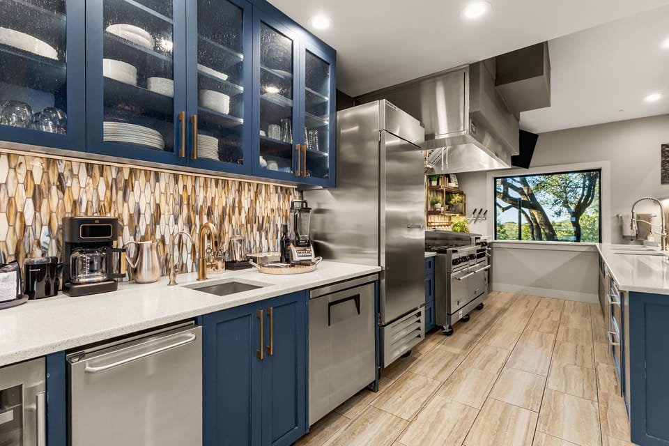 Chef’s kitchen featuring premium appliances, and expansive counter space