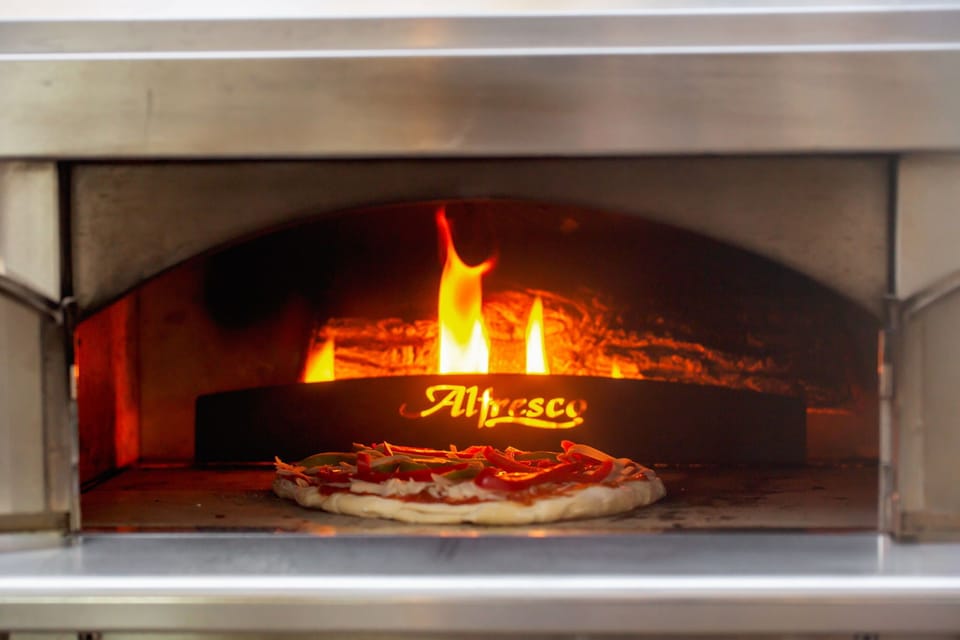 Gas-fired pizza oven in action, perfect for crafting delicious pizza pies!