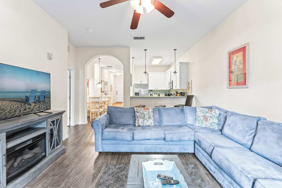 Bright living area with sofa sleeper and Smart TV