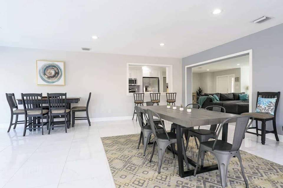 "Host dinners, game nights, or work sessions in this spacious open-plan layout—perfect for families, groups, and remote workers. Multiple dining areas and cozy lounge make this vacation rental feel like home!"