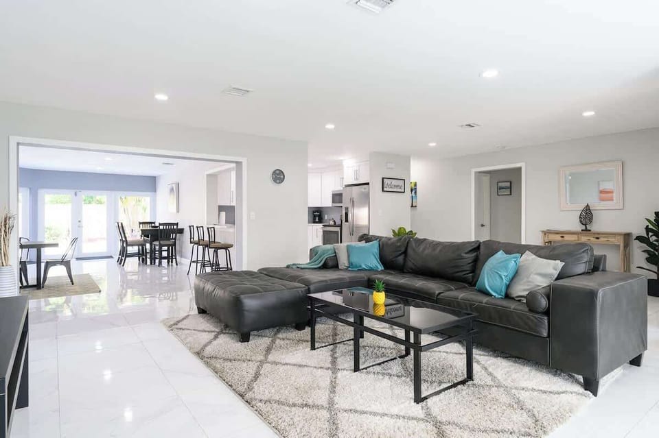 "Gather, cook, and relax in this bright open-concept home with modern kitchen, cozy lounge, and stylish dining—perfect for vacation rentals, long-term stays, or relocation guests."