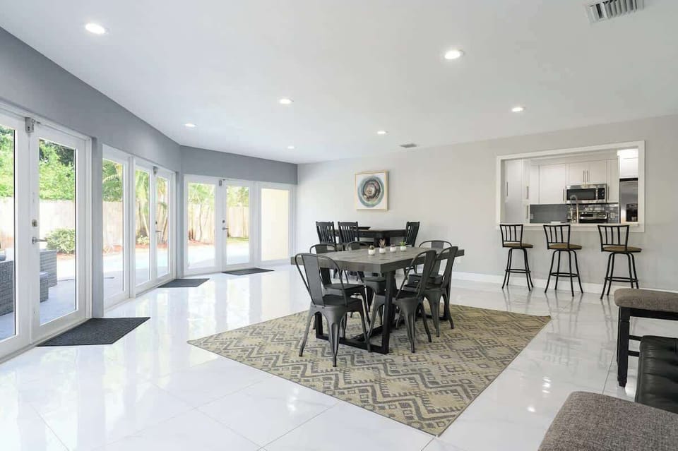 "Enjoy meals and memories in this spacious dining and kitchen area—perfect for family vacations, group getaways, or remote work stays. Bright, modern, and steps from outdoor serenity!"
