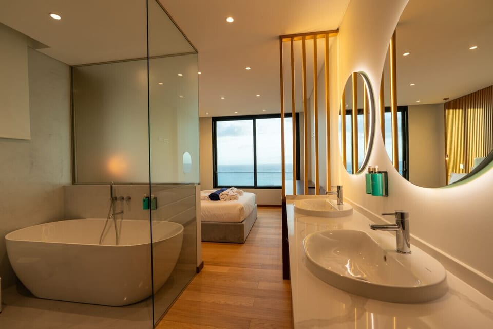 Master suite with bathtub and ocean views.