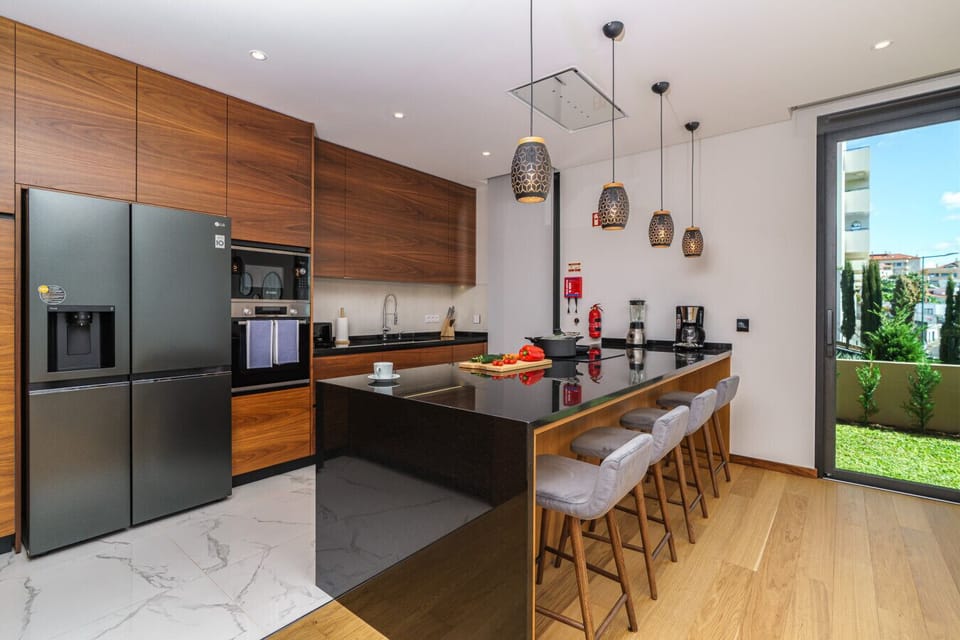 Modern kitchen with stone island in Madeira.