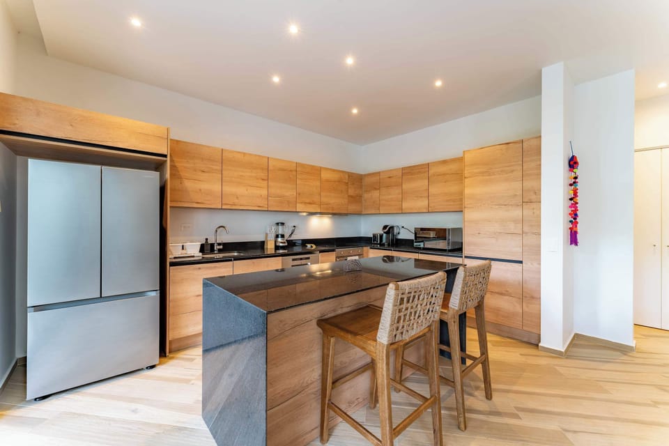 Kitchen | A modern space with warm wood and sleek finishes