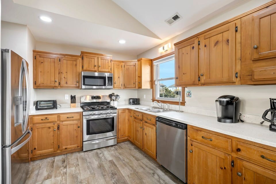 The kitchen is fully equipped with stainless steel appliances and ample counter space.