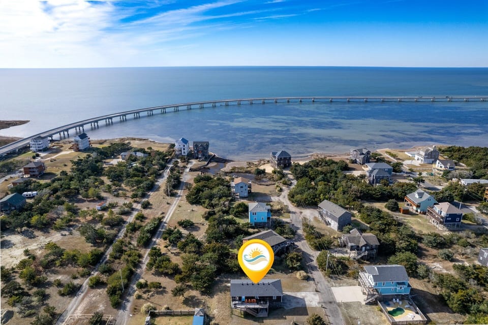 Down By The Dunes is a charming soundside home perfectly situated between the Pamlico Sound and the Atlantic Ocean.