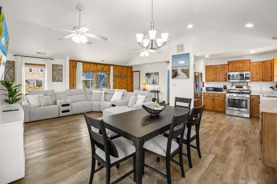 The open great room features cathedral ceilings and abundant natural light.