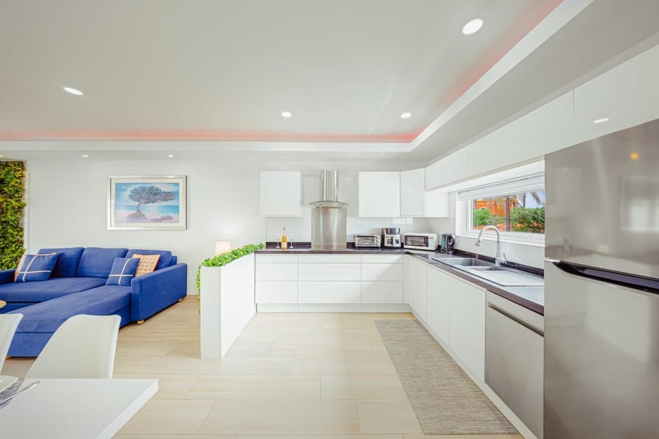 Meet your dream vacation kitchen! Sleek and modern—it's the perfect place to whip up a gourmet breakfast or prep for a group dinner after a day exploring the island.